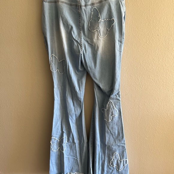 Women's Light Blue Flared Jeans with Butterfly Accents - Picture 5 of 9